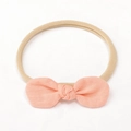 Bandeau bébé en nylon doux avec un nœud en lin rose pêche sur une bande chair - Rose Anna