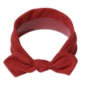 Deep red elastic fabric baby headband featuring a knotted bow design on a soft knit base - Dark Red