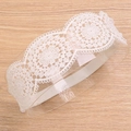 White floral lace headband for baby girls with soft hollow design on clear display stand - Wave Edge Hollow Floral Style (MB2509)