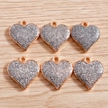 Pack of 6 heart pendants with silver glitter and rose gold frame on a wooden background - White
