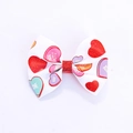 White ribbon bow hair clip with colorful leopard heart print and red glitter center - White with Colorful Hearts (MC5148)