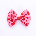 Pink heart patterned hair bow with red glitter center on a clean white background - Rose Red Heart (MC5149)