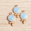 Macro view of light blue enamel lollipop charms with gold metal bow and top loop - 10 Pieces Pack / Blue