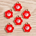 Macro detail of red enamel cherry blossom pendants with Yin Yang symbols on wood - Six-Petal Flower Tai Chi Pendant / 10 Pieces Pack / Red