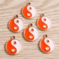 Detail of alloy yin yang heart charms with orange and white enamel on wood background - 10 Pieces Pack / Orange Round Tai Chi