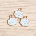 Cute light blue enamel smiling cloud pendants with golden alloy edges on wood surface - Blue