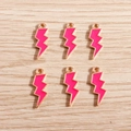 Detailed view of pink enamel lightning bolt charms with gold plating for DIY jewelry making - 10 Pieces Pack / Rose Red