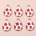 Détail de 6 breloques en alliage avec émail blanc et motifs de fleurs rouges - Œuf Floral Blanc Rouge (1119)