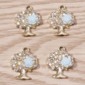 Ciondoli ad albero dorati con strass bianchi e una rosa in resina blu chiaro - Oro Verde