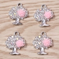 Dettaglio di ciondoli albero della vita con strass e rosa in resina rosa per gioielli fai da te - Rosa argento