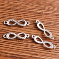 Silver infinity connectors with rhinestones for DIY jewelry making on wood background - 20 Pieces Set / White K/Silver