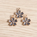 Close-up of cherry blossom flower pendants with grey enamel and central crystal accents - 10 Pieces Pack / Black