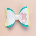 Detailed close-up of Easter bunny bow hair clip with white glitter and plush pom-pom tail - Hollow Pink Rabbit Bow (MC6506)