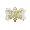 Close-up of white fabric bow hair clip with gold glitter snowflake for Christmas - Gold Style (MC5959)
