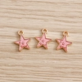 Macro shot of pink enamel star charms with gold trim for handmade DIY jewelry - 10 Pieces Pack / Purple