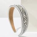 Close-up of wide baroque headband with white pearls and sparkling crystal flower patterns - White