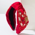 Détail du bandeau rouge perlé avec lettrage Xmas, strass et motifs de canne à sucre - Rouge