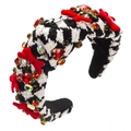 Detail of broad headband with black and white houndstooth fabric and red velvet bows - Bow