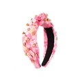 Détail du serre-tête imprimé léopard rose avec strass et décoration de nœud élégante - Nœud Rose
