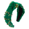 Close-up of deep green velvet headband with multicolor rhinestones and gold embroidery - Green