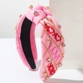 Rosa geknotetes Stirnband mit bestickten LOVE-Schriftzügen und Herz-Steinchen - Rosa