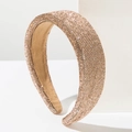 Detail of luxurious wide headband covered in sparkling champagne gold rhinestones - Brown