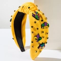 Details von gelbem Mardi Gras Haarreif mit bunten Strasssteinen und Festmotiven - Gelb