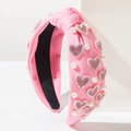 Detalle de diadema rosa con nudo, corazones de diamantes de imitación y perlas blancas - Rosa