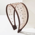 Brown mesh wide headband with glittering rhinestones and silver rivets on white display - Brown