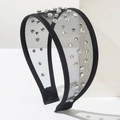 Close-up of black tulle headband featuring sparkling rhinestones on wide mesh fabric - Black