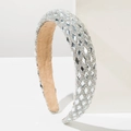 Close-up of wide headband with full diamond rhinestones and soft khaki fabric lining - White