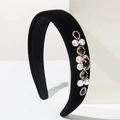 Detailed macro view of vintage Baroque velvet headband with pearls and rhinestones - Black