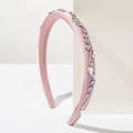 Cerchietto in raso rosa con strass scintillanti su sfondo bianco minimalista - Rosa