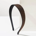 Sparkling coffee brown rhinestone headband with non-slip grip on a white minimalist block - Brown