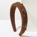 Detailed texture of caramel wool headband with grey crystal flowers on sponge base - Brown