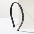 Detalle de diadema negra con cristales y perlas sobre base de piedra blanca elegante - Negro Brillante