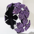 Detail of purple rhinestone flower headband with opal stones on black velvet wide band - Purple