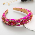 Close-up of rose red satin headband with gold embroidery and colorful gemstones - Rose Red