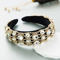 Luxury Baroque headband with black velvet, gold border and sparkling crystals on white stand - White