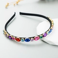 Elegante cerchietto nero sottile con strass colorati scintillanti e castoni dorati - Ovale