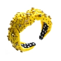 Detail of yellow velvet knotted headband with rhinestones, studs and Angel metal logo - Yellow