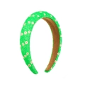 Close-up of green sponge headband featuring textured floral pattern and brown non-slip lining - Fluorescent Green