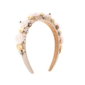 Detailed view of vintage headband with beige fabric flowers, pearls and shiny rhinestones - White
