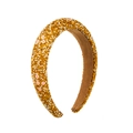Detailed shot of padded sponge headband with golden rhinestones, pearls and pink flowers - Gold