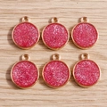 Close-up of rose gold circular pendants with shiny pink glitter for DIY jewelry making - 10 Pieces Pack / Rose Red