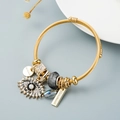 Bracciale rigido dorato con ciondolo occhio del male e cristalli stile boho - Oro/Grigio