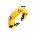 Detailed view of yellow braided Halloween headband with pumpkin, bat and sequin accents - Yellow