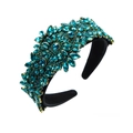Detail view of Baroque velvet headband with intricate teal crystals and floral rhinestones - Blue