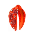 Détail d'un serre-tête noué orange avec patchs de rugby perlés et de strass - Orange