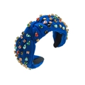 Detalle de diadema anudada azul real con pedrería de colores sobre fondo blanco - Azul